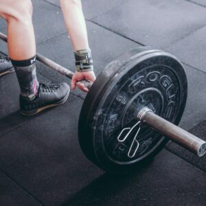 person holding barbell