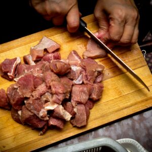 sliced meat on brown wooden chopping board
