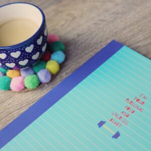blue ceramic cup on tabletop
